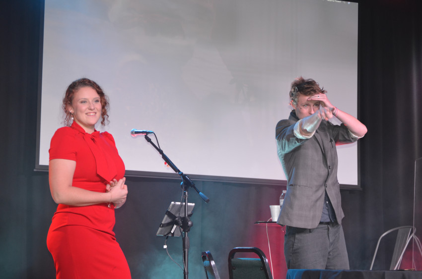 James Kenyon performing a stage show with an audience volunteer